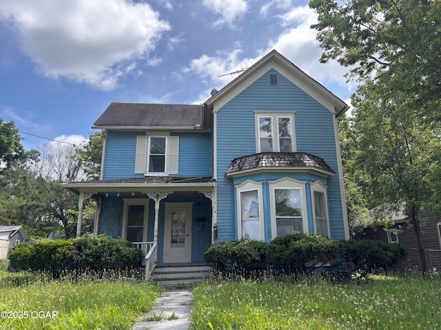 504 Cooper St, Carthage, MO 64836 - view of front facade featuring covered porch