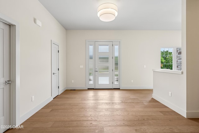 5077 Eagle Valley Dr, Joplin, MO 64804 - foyer with light wood-type flooring and baseboards