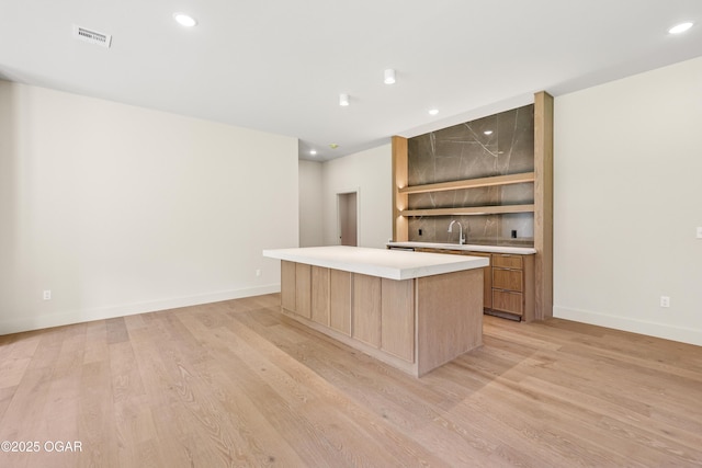 5077 Eagle Valley Dr, Joplin, MO 64804 - indoor wet bar with light wood-style floors and recessed lighting
