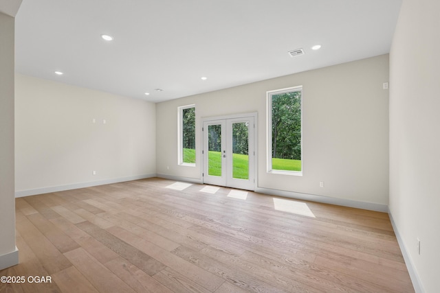 5077 Eagle Valley Dr, Joplin, MO 64804 - spare room featuring light wood-style flooring, french doors, and recessed lighting