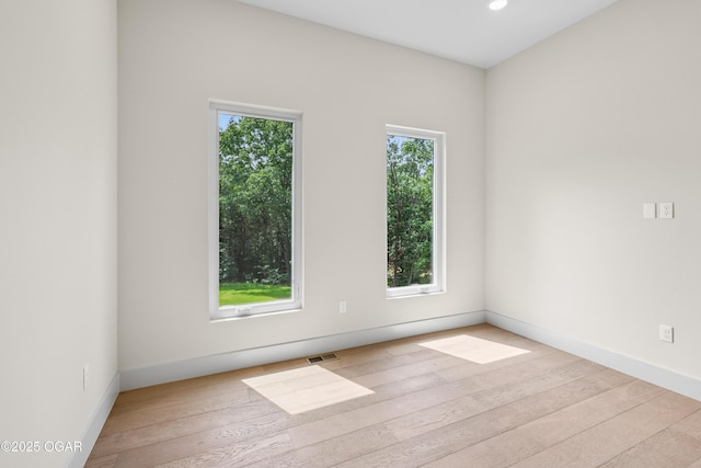 5077 Eagle Valley Dr, Joplin, MO 64804 - empty room with plenty of natural light, hardwood / wood-style floors, and recessed lighting