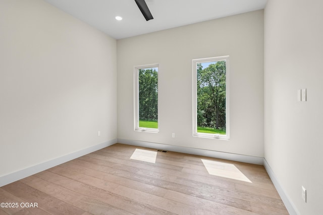 5077 Eagle Valley Dr, Joplin, MO 64804 - empty room featuring light wood-style flooring, ceiling fan, and recessed lighting