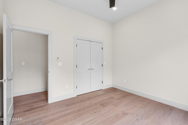5077 Eagle Valley Dr, Joplin, MO 64804 - unfurnished bedroom with light wood-style floors and a closet