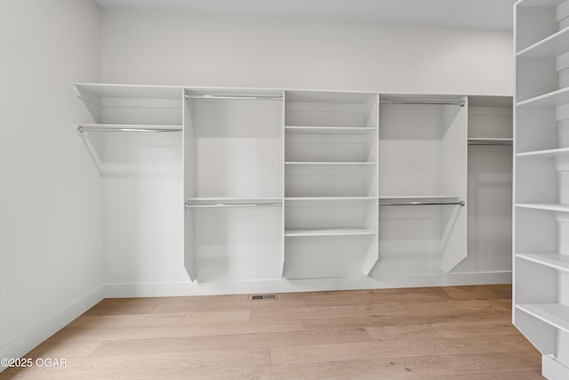 5077 Eagle Valley Dr, Joplin, MO 64804 - spacious closet with wood finished floors