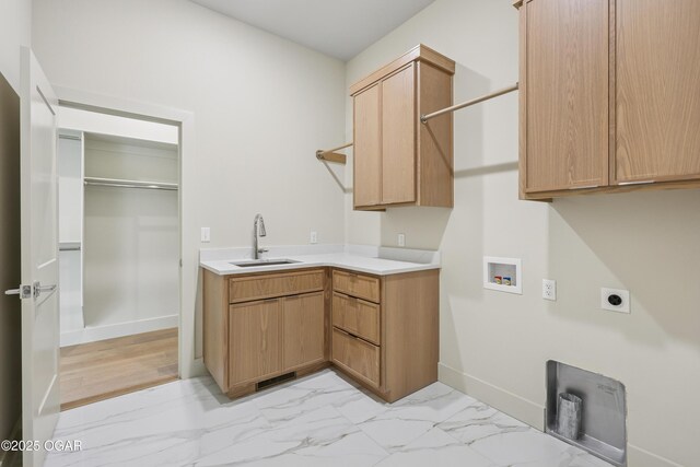 5077 Eagle Valley Dr, Joplin, MO 64804 - washroom with hookup for an electric dryer, washer hookup, light marble finish floors, and cabinet space