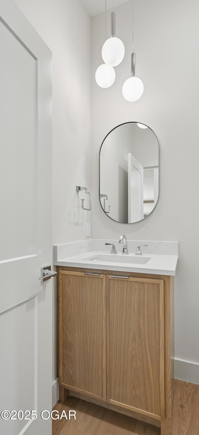 5077 Eagle Valley Dr, Joplin, MO 64804 - bathroom featuring vanity and wood finished floors