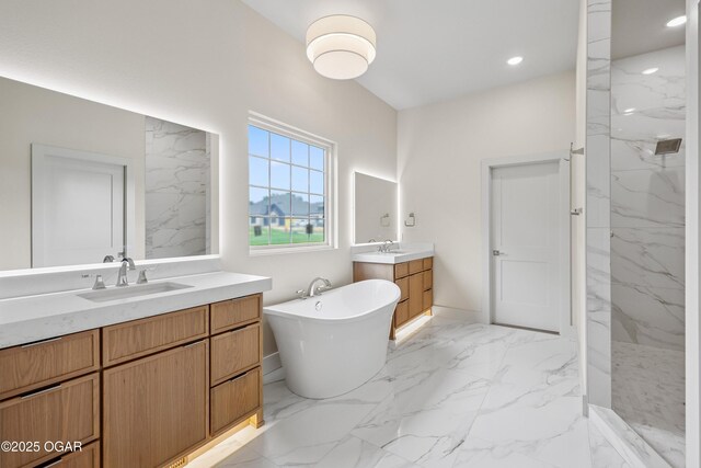5077 Eagle Valley Dr, Joplin, MO 64804 - full bath with two vanities, marble finish flooring, a marble finish shower, a freestanding bath, and recessed lighting