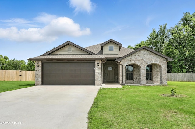 2102 S Greystone Sq, Oronogo, MO 64855 - view of front of house with brick siding, a garage, concrete driveway, and a shingled roof