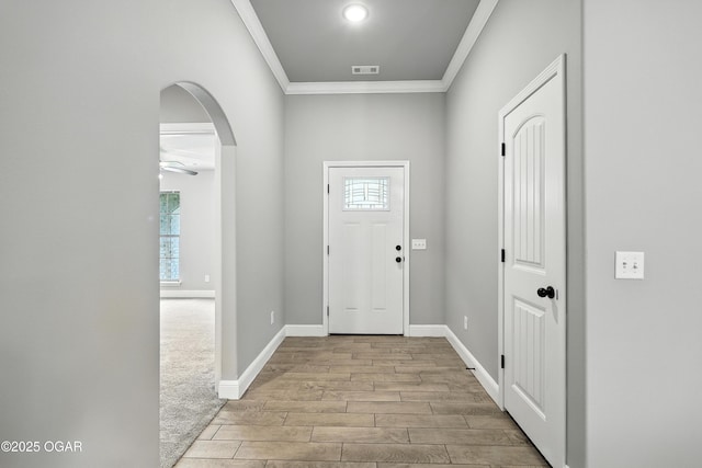 2102 S Greystone Sq, Oronogo, MO 64855 - foyer featuring ornamental molding, wood finished floors, plenty of natural light, arched walkways, and ceiling fan