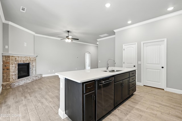2102 S Greystone Sq, Oronogo, MO 64855 - kitchen featuring stainless steel dishwasher, light wood-type flooring, ornamental molding, a ceiling fan, and light countertops