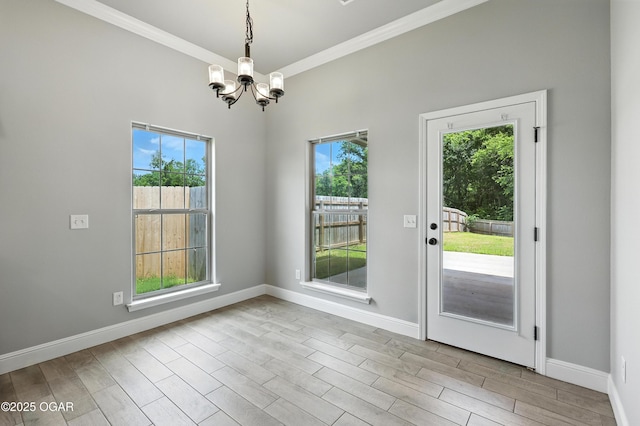 2102 S Greystone Sq, Oronogo, MO 64855 - unfurnished dining area featuring a chandelier, crown molding, and wood finished floors