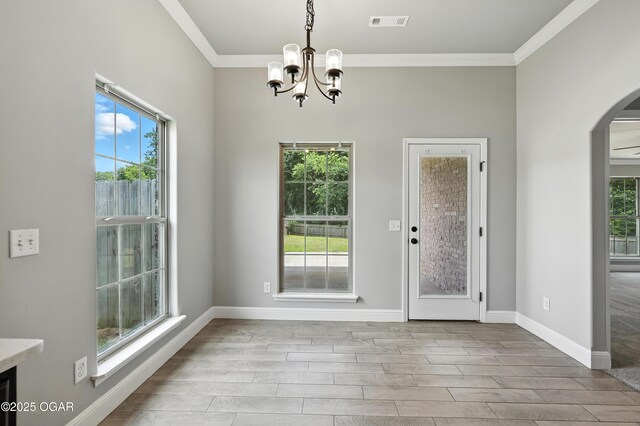 2102 S Greystone Sq, Oronogo, MO 64855 - unfurnished dining area with arched walkways, ornamental molding, a chandelier, and wood finished floors