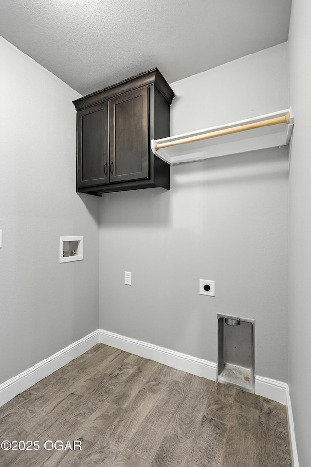 2102 S Greystone Sq, Oronogo, MO 64855 - laundry room featuring hookup for a washing machine, wood finished floors, hookup for an electric dryer, and cabinet space