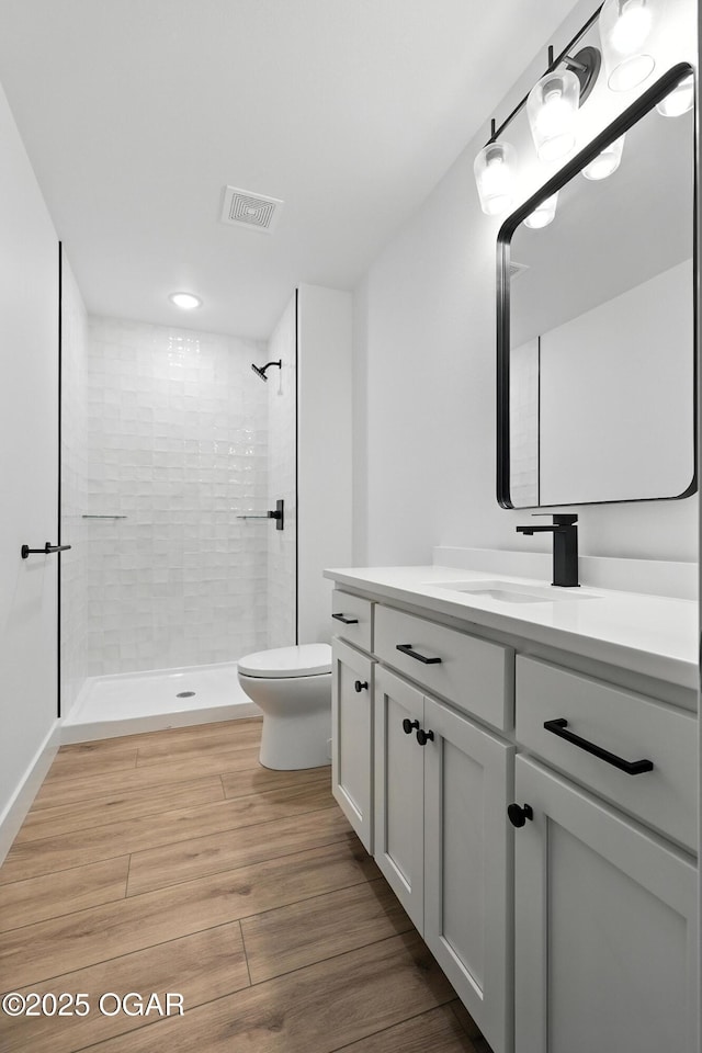4308 Par Ln, Joplin, MO 64804 - full bath with vanity, tiled shower, and wood finished floors