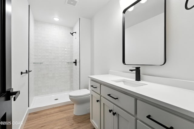 4308 Par Ln, Joplin, MO 64804 - full bath with wood finished floors, vanity, a tile shower, and recessed lighting
