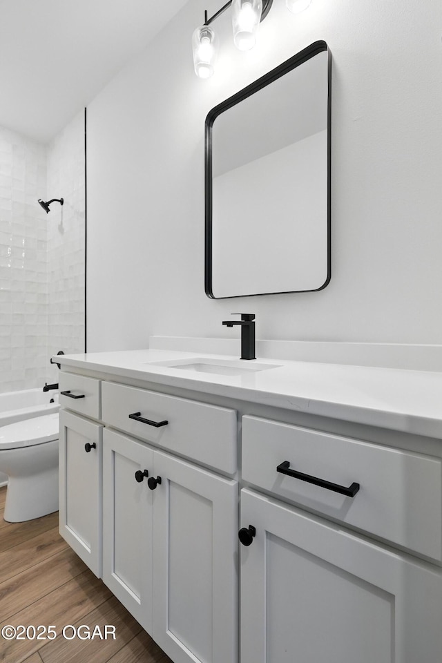4308 Par Ln, Joplin, MO 64804 - bathroom featuring vanity, wood finished floors, and shower / washtub combination