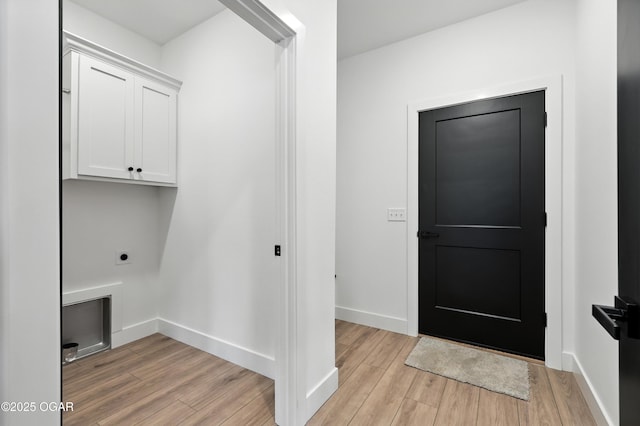 4308 Par Ln, Joplin, MO 64804 - laundry area with cabinet space, hookup for an electric dryer, and light wood-style floors