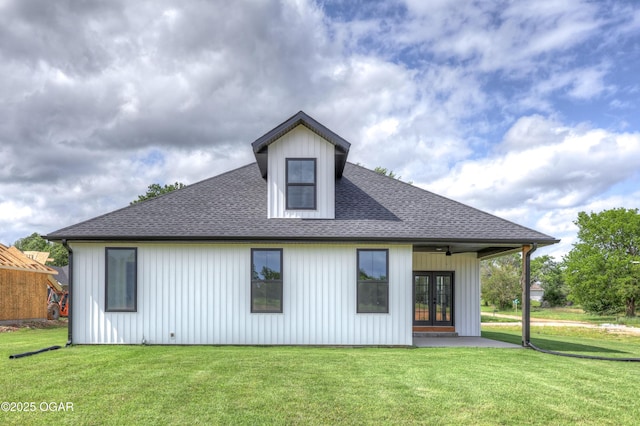 4308 Par Ln, Joplin, MO 64804 - rear view of property featuring french doors, a lawn, a shingled roof, a patio, and board and batten siding