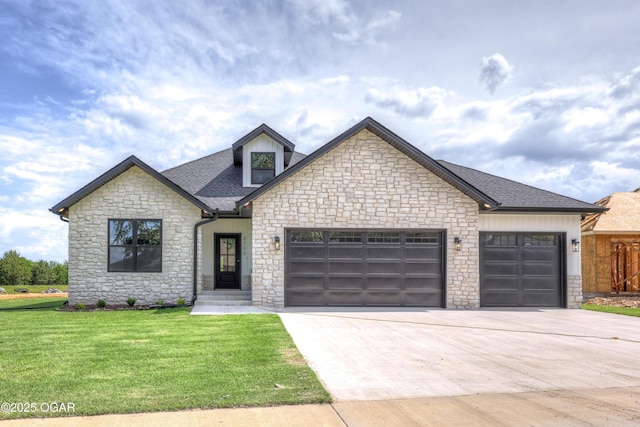 4308 Par Ln, Joplin, MO 64804 - french country home with stone siding, a garage, concrete driveway, a front yard, and a shingled roof