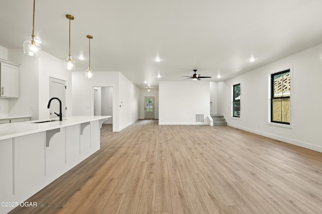 4402 Par Ln, Joplin, MO 64804 - unfurnished living room with ceiling fan, light wood-style floors, and recessed lighting