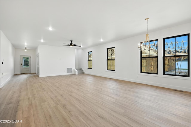 4402 Par Ln, Joplin, MO 64804 - unfurnished living room with a chandelier, light wood finished floors, stairway, recessed lighting, and a ceiling fan