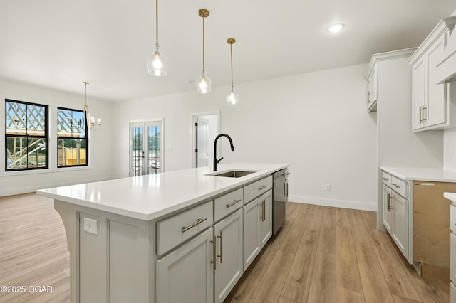 4402 Par Ln, Joplin, MO 64804 - kitchen with dishwasher, light countertops, light wood-style floors, and a center island with sink