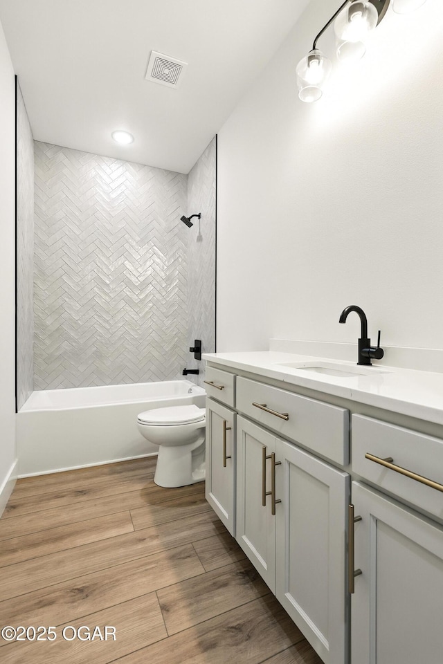 4402 Par Ln, Joplin, MO 64804 - full bathroom with vanity, tub / shower combination, wood finished floors, and recessed lighting