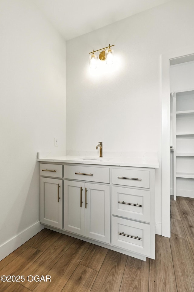 4402 Par Ln, Joplin, MO 64804 - bathroom featuring vanity and wood finished floors