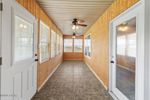 2329 S Willard Ave, Joplin, MO 64804 - unfurnished sunroom featuring wood walls and a ceiling fan