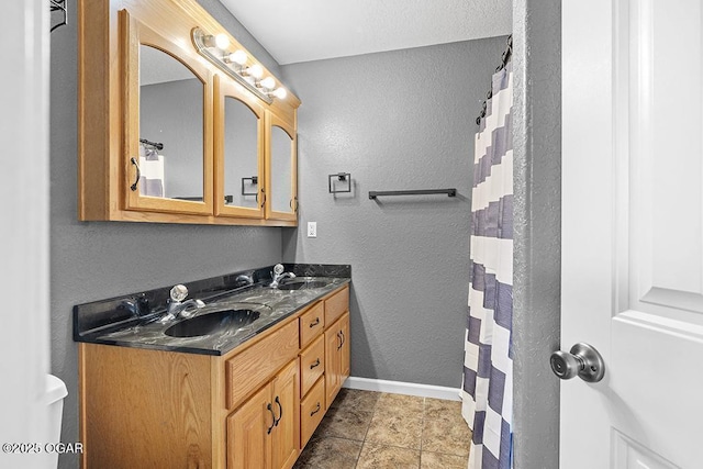 2329 S Willard Ave, Joplin, MO 64804 - full bath with double vanity and a textured wall