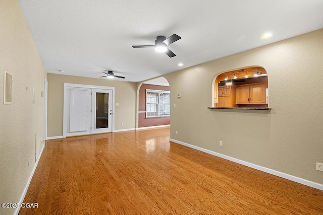 2329 S Willard Ave, Joplin, MO 64804 - spare room with ceiling fan, light wood finished floors, arched walkways, and recessed lighting