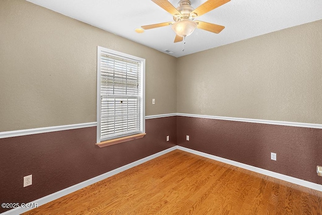 2329 S Willard Ave, Joplin, MO 64804 - spare room featuring wood finished floors and ceiling fan