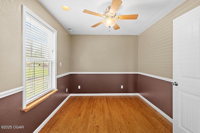 2329 S Willard Ave, Joplin, MO 64804 - empty room featuring wood finished floors and ceiling fan