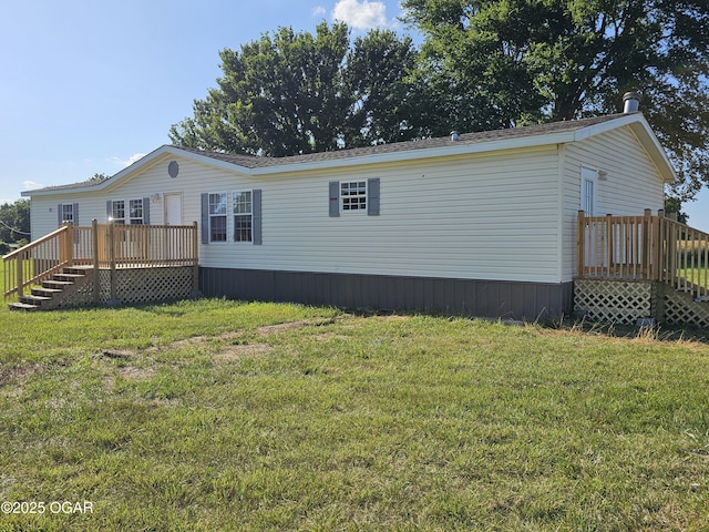 205 College St, Stark City, MO 64866 - view of side of home with a deck, stairs, and a yard