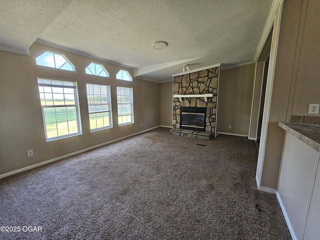205 College St, Stark City, MO 64866 - unfurnished living room with a textured ceiling, ornamental molding, carpet floors, and a fireplace