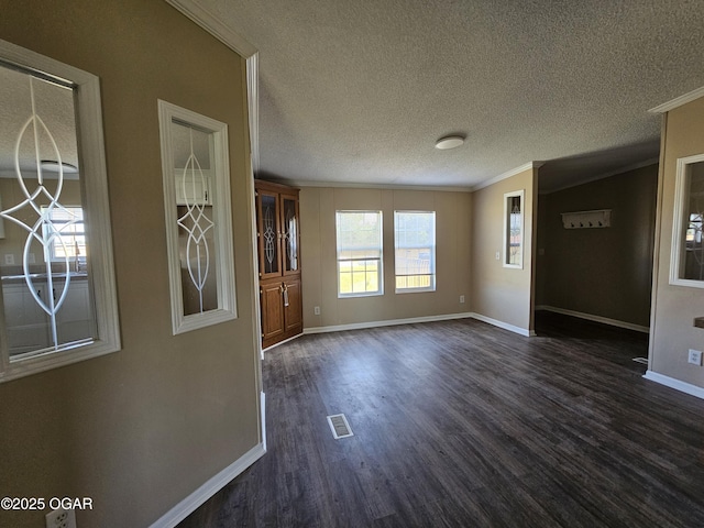 205 College St, Stark City, MO 64866 - spare room with ornamental molding, dark wood-style flooring, and a textured ceiling