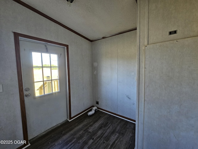 205 College St, Stark City, MO 64866 - unfurnished room with dark wood-type flooring, ornamental molding, a textured ceiling, and vaulted ceiling