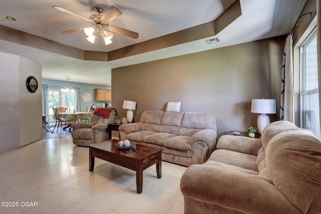 1717 Logan Drive `, Webb City, MO 64870 - living room featuring a chandelier, a ceiling fan, and light wood-style floors