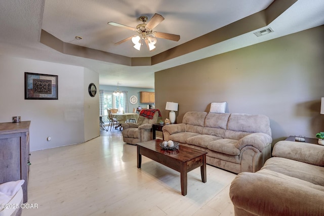 1717 Logan Drive `, Webb City, MO 64870 - living room featuring ceiling fan, a chandelier, and light wood-type flooring