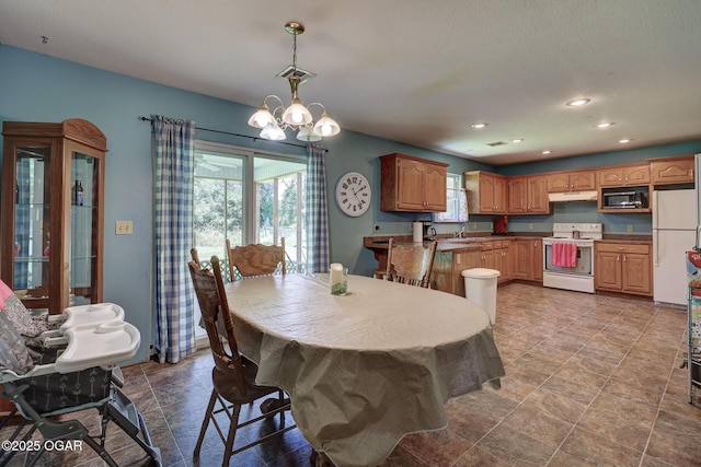 1717 Logan Drive `, Webb City, MO 64870 - dining area with recessed lighting and a chandelier