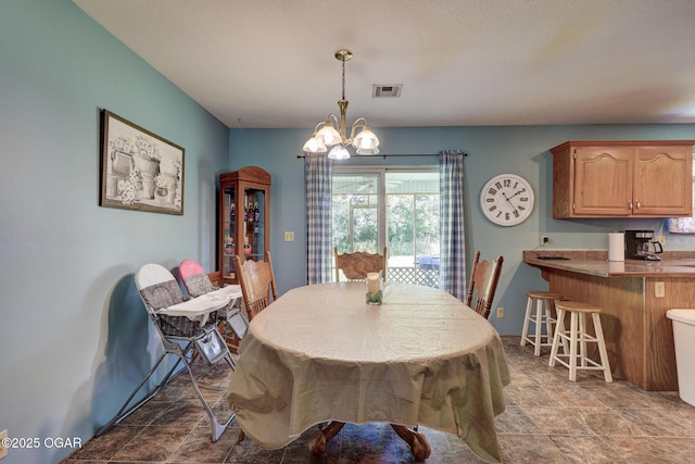 1717 Logan Drive `, Webb City, MO 64870 - dining space featuring a chandelier and stone finish floors