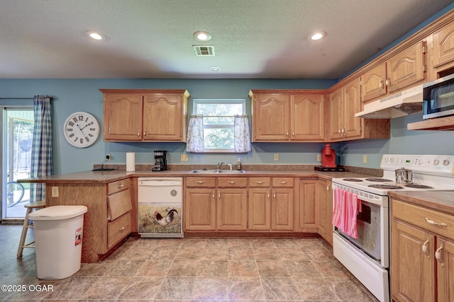 1717 Logan Drive `, Webb City, MO 64870 - kitchen featuring white appliances, under cabinet range hood, a peninsula, recessed lighting, and a breakfast bar
