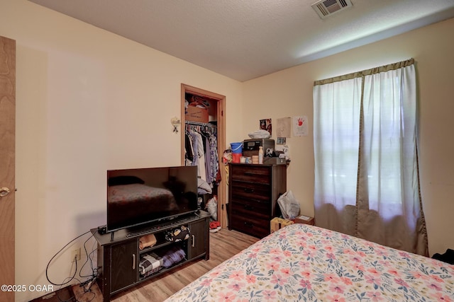1717 Logan Drive `, Webb City, MO 64870 - bedroom with light wood finished floors, a spacious closet, and a closet