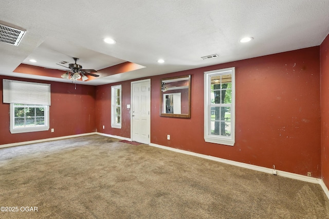 624 N Devon St, Webb City, MO 64870 - spare room featuring carpet, a ceiling fan, a tray ceiling, recessed lighting, and a textured ceiling