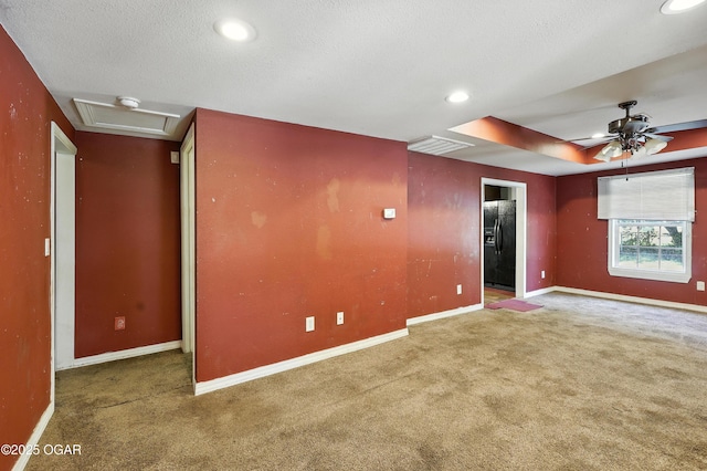624 N Devon St, Webb City, MO 64870 - carpeted spare room with recessed lighting, ceiling fan, attic access, and a textured ceiling