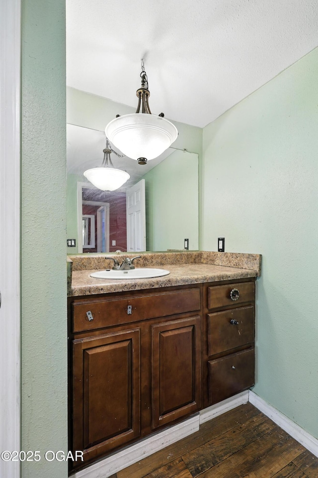 624 N Devon St, Webb City, MO 64870 - bathroom featuring vanity and wood finished floors