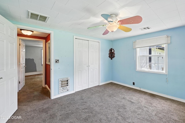 624 N Devon St, Webb City, MO 64870 - unfurnished bedroom featuring heating unit, carpet, a closet, and a ceiling fan