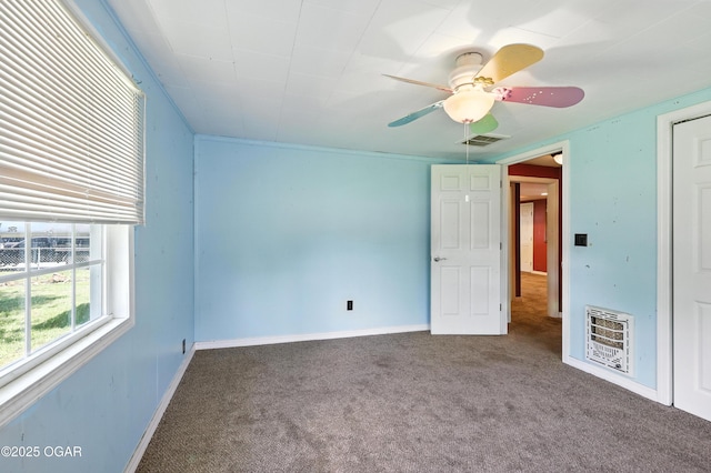 624 N Devon St, Webb City, MO 64870 - unfurnished bedroom featuring heating unit, carpet, and a ceiling fan