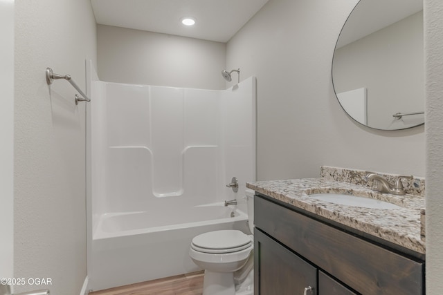 1220 Sheila Ann Dr, Carthage, MO 64836 - bathroom featuring wood finished floors, vanity, and washtub / shower combination