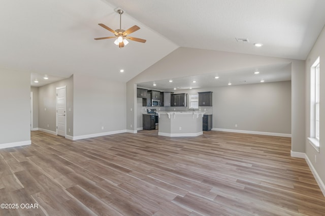 1220 Sheila Ann Dr, Carthage, MO 64836 - unfurnished living room with ceiling fan, light wood-style flooring, recessed lighting, plenty of natural light, and high vaulted ceiling